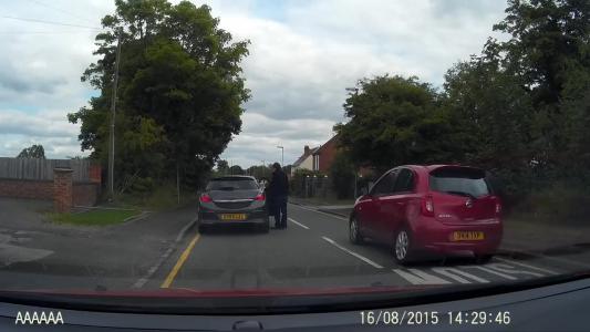 Red Nissan Micra (DN14TXP)