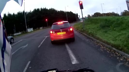 Red Volkswagen Golf (RK55POV)