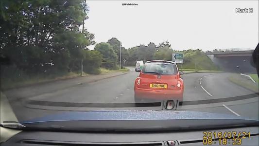 Red Nissan Micra (SH10VBC)