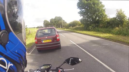 Red Vauxhall Zafira (SK54JUE)